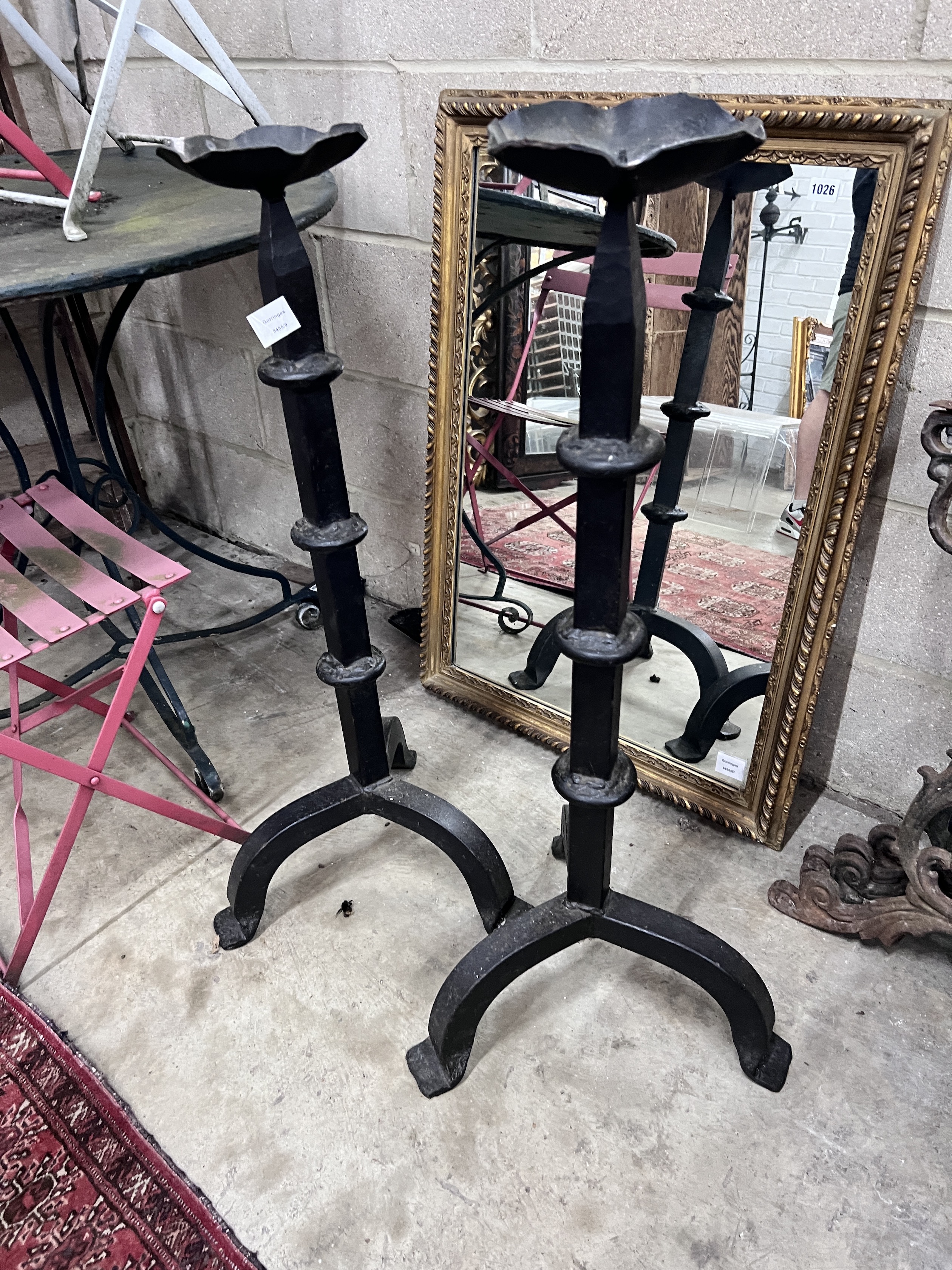 A pair of tall 17th century style wrought iron pricket candlesticks, height 93cm